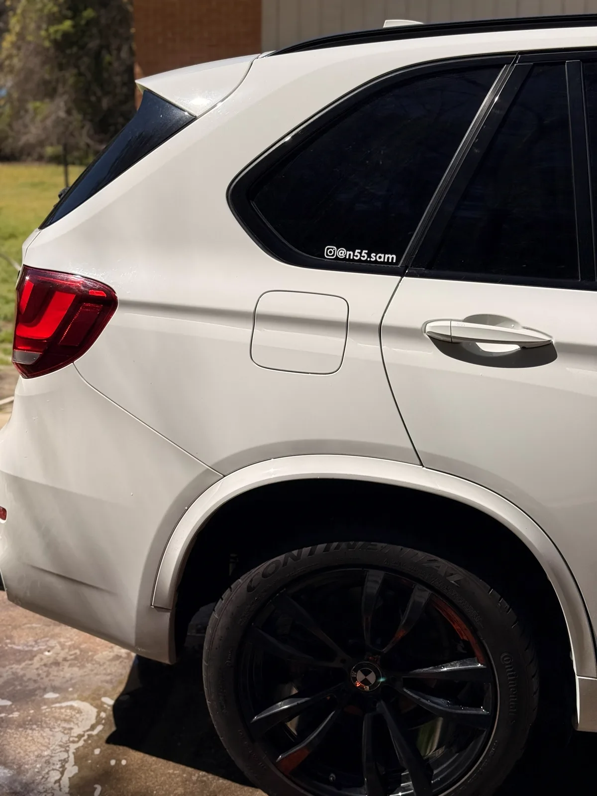 BMW X5 headlight and wheel, detail close-up
